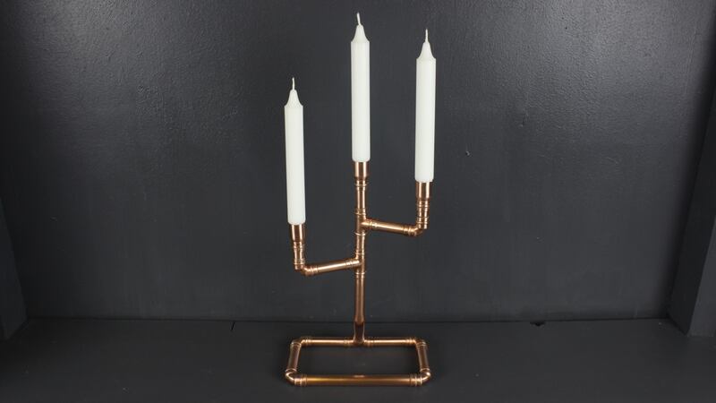 A copper pipe candelabra by Emmet Bosonnet of Kopper Kreation