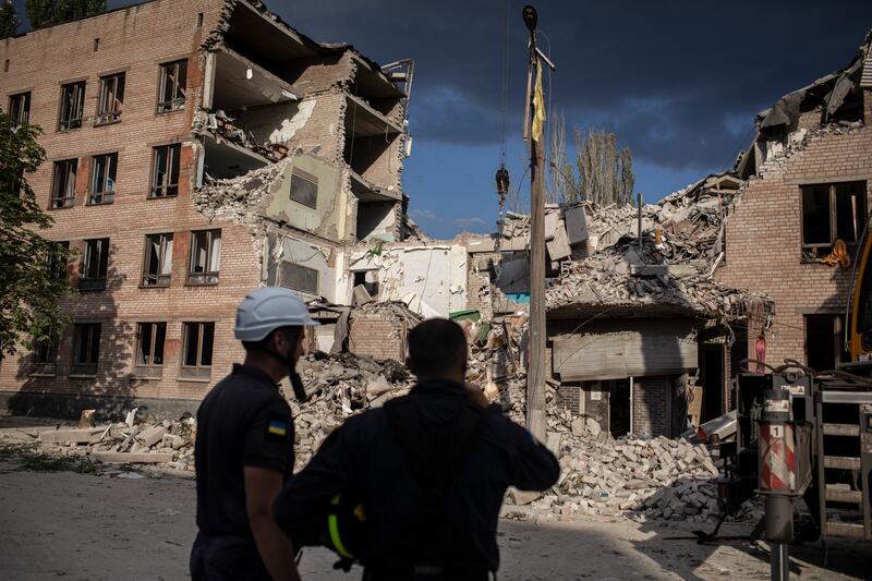  A rescue team working at a university building struck by a Russian missile in Kryvyi Rih, Ukraine. Photograph: Diego Ibarra Sanchez/The New York Times)
                      