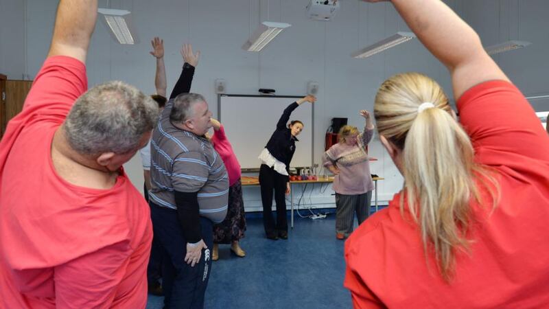 Eimear O’Malley, physiotherapist (centre) at St Columcille’s Hospital, Loughlinstown, takes participants through an exercise class, part of the multidisciplinary approach to weight management. Photograph: Alan Betson