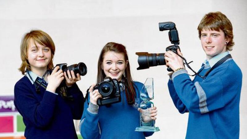 Photojournalism category winners, Niamh Hogan, Coláiste Choilm, Ballincollig, (1st, centre) with Elzbieta Pranskute, Maynooth Post Primary School (2nd) and Jack Lyons, Coláiste Choilm, Ballincollig (3rd). photograph: dara mac dónaill