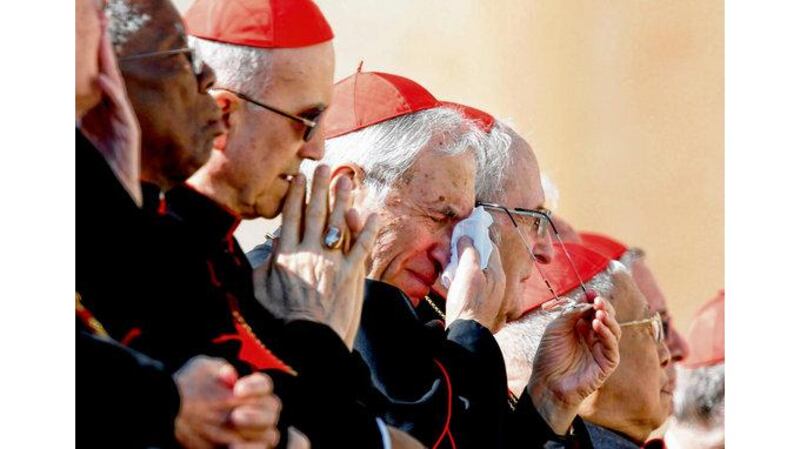 Cardinals including Archbishop Antonio Rouco Varela of Madrid react emotionally to the outgoing pope's words. photographs: alessandro bianchi/reuters