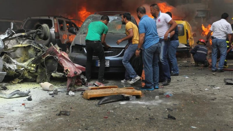 People gather at the site of the explosion. Sources were unable to confirm initial reports from medics at the scene that an unspecified number were killed in the massive blast. Photograph: Hasan Shaaban/Reuters