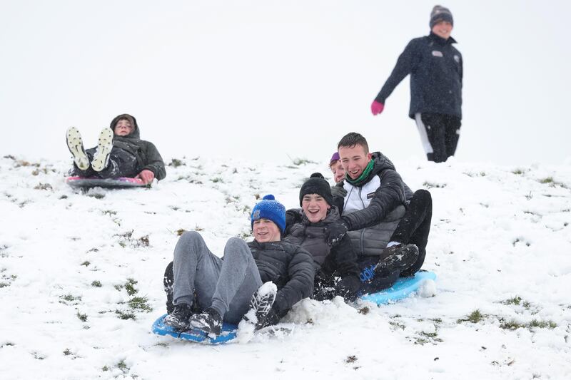 Teenagers having fun on sleds and bodyboards in the snow at Lissycasey, Co Clare on Thursday. Photograph: Eamon Ward