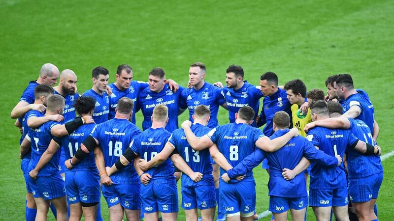 Leinster players huddle as they come to terms with their defeat in the Champions Cup final. Photograph: Reuters