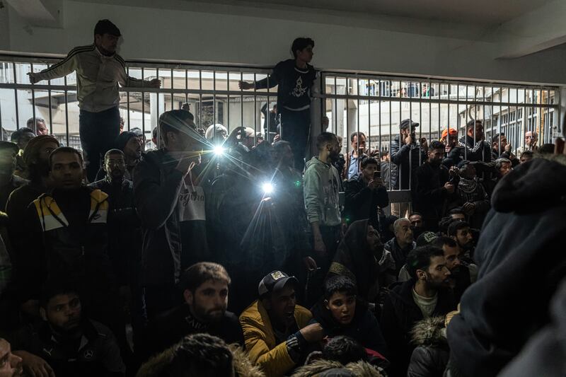 Syrians wait their turn to search for loved ones inside the infamous Sednaya prison, on the outskirts of Damascus, Syria, on Monday. Photograph: Daniel Berehulak/New York Times