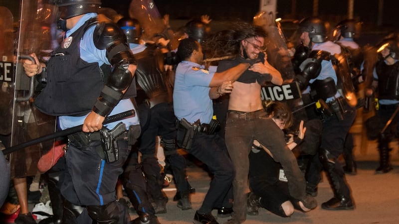 Police in New Orleans  clash with protesters on Wednesday night. Photograph: Chris Granger/The Advocate via AP