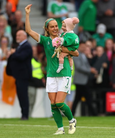 Julie-Ann celebrates with Rosie on the pitch after the qualifier with France in Cork last July. Photograph: James Crombie/Inpho