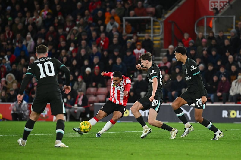 Cameron Archer scores for Southampton under pressure from Liverpool's Tyler Morton and Jarell Quansah. Photograph: Dan Mullan/Getty Images