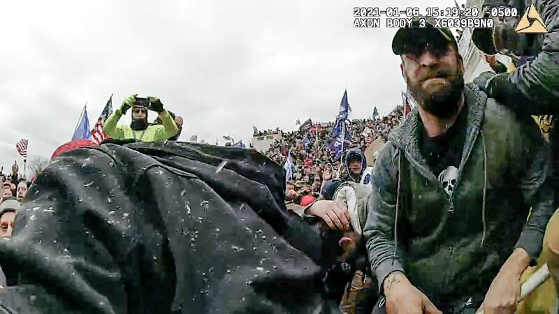 A still from video from officer Michael Fanone’s body camera shows the scuffle in which Daniel Rodriguez drove a stun gun into his neck. Photograph: Department of Justice via The New York Times