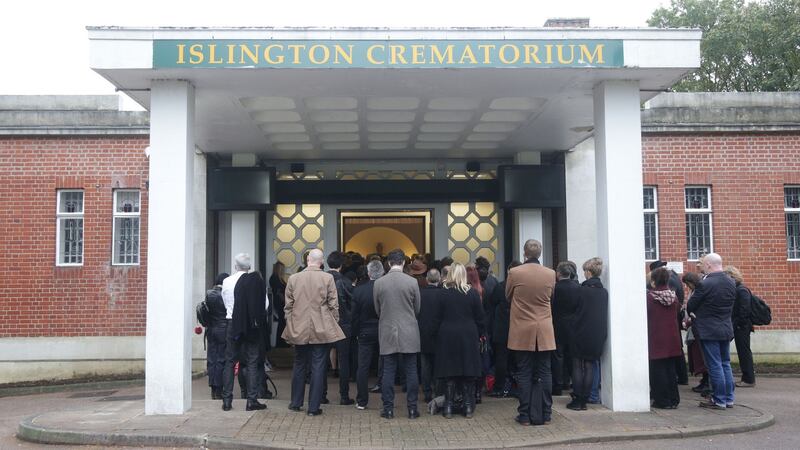 The congregation outside the chapel at the funeral of comedian Sean Hughes at Islington and Camden Cemetery in London. Photograph: Yui Mok/PA Wire