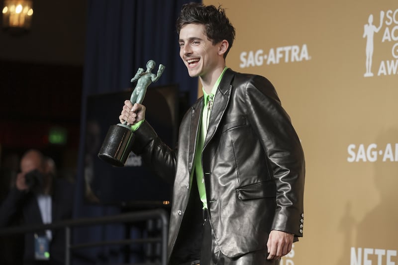 Timothée Chalamet with the SAG award for Outstanding performance by a male actor in a leading role. Photograph: Allison Dinner/EPA