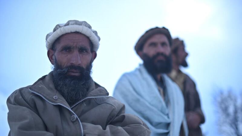 Relatives seen after searching for avalanche victims in the district of Bazarak in the province of Panjshir, north of Kabul on February 25th, 2015. Photograph: SHAH MARAI/AFP/Getty Images