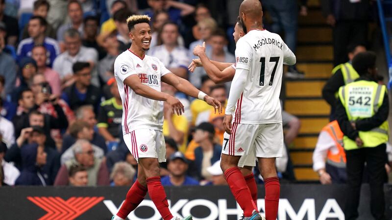 Sheffield United’s Callum Robinson celebrates with Ireland teammate David McGoldrick after creating his side’s late equaliser at Stamford Bridge. Photograph: John Walton/PA