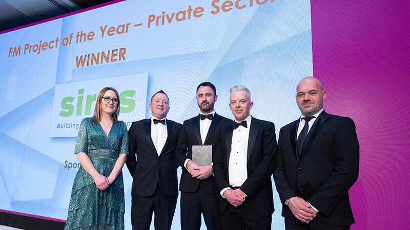 Ian Glendon, engineering director at Mitie Facilities Management, presents the FM Project of the Year - Private Sector award to Sirus team