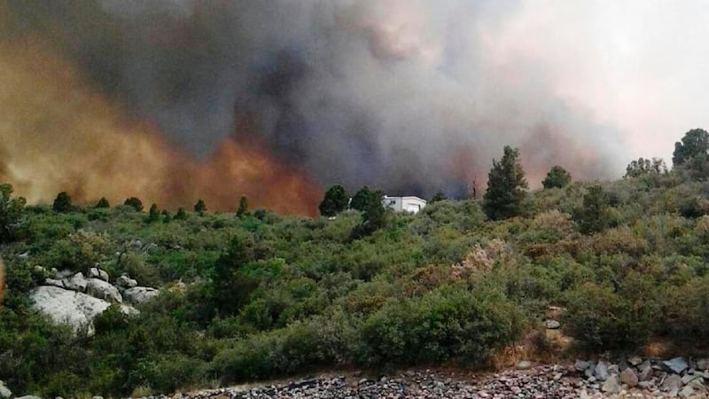 Firefighters move away from the Yarnell Hill Fire, near the town of Yarnell, Arizona, 120 km northwest of Phoenix . Nineteen firefighters were killed battling a fast-moving wildfire. Photograph: /Arizona State Forestry Division/Handout/Reuters.