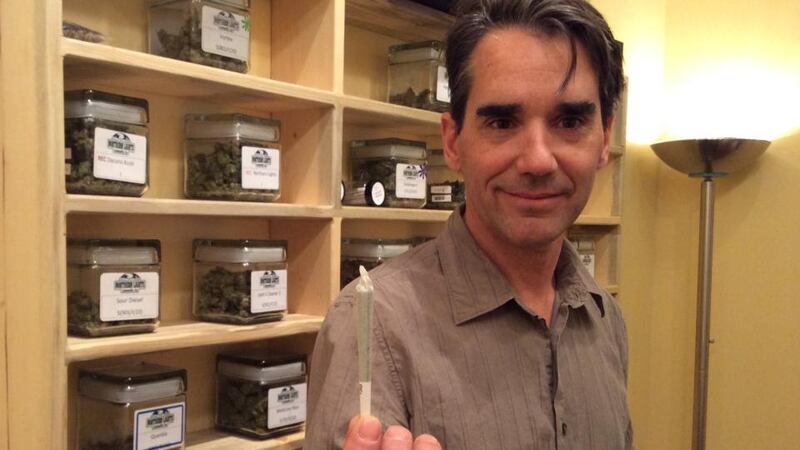 High times: Mitch Woolhiser of Northern Lights Cannabis Co, with a joint ready for sale. Photograph: Simon Carswell