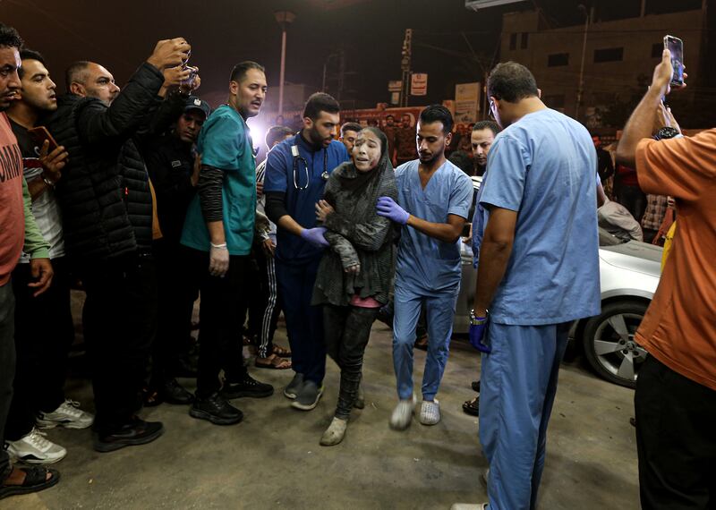 A woman injured in an Israeli airstrike is brought into Nasser Hospital in Khan Younis, in southern Gaza, on Tuesday. Photograph: Yousef Masoud/The New York Times
                      