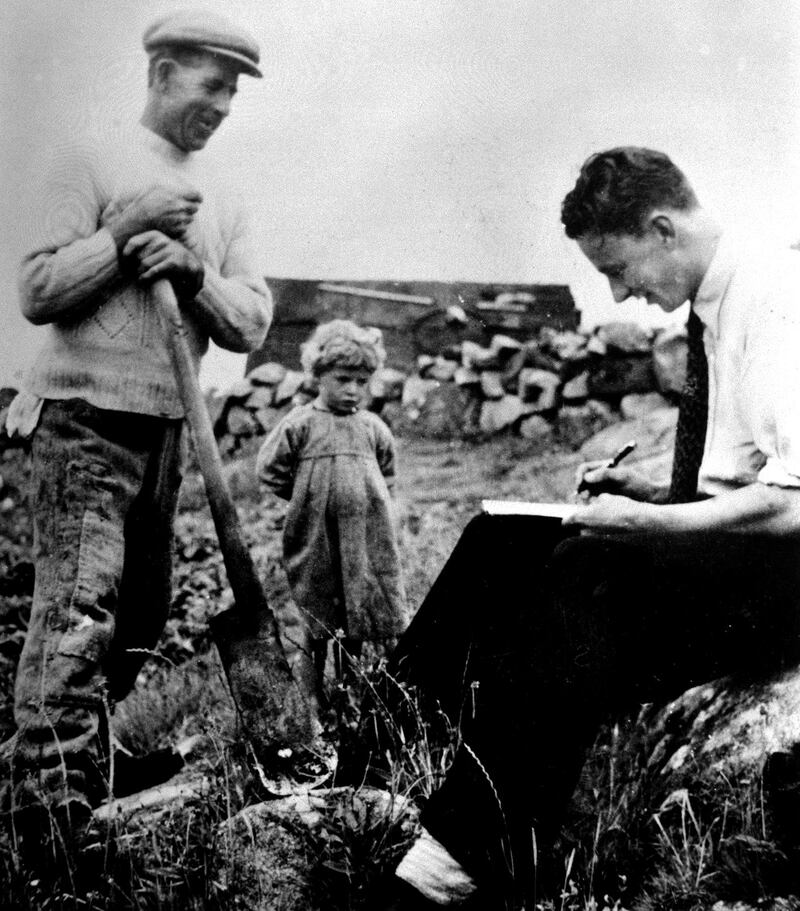 Séamus Ennis taking notes from Colm Ó Caodháin in Glinsk in 1945. Photograph: Folklore Photograph Collection/UCD