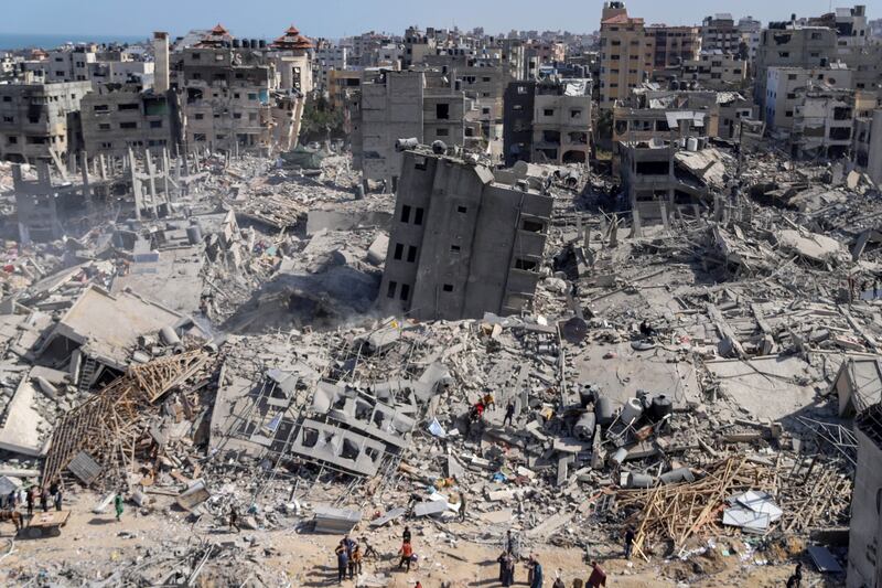 Palestinians inspect the damage at and near Al-Shifa Hospital after the Israeli army withdrew from it following a two-week military operation, in Gaza City, April 1st. Photograph: Mohamed Hajjar/EPA-EFE