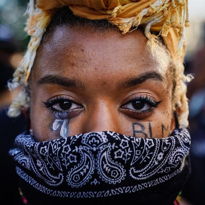 A protester in Atlanta, Georgia, on Sunday. Photograph: Elijah Nouvelage/Getty