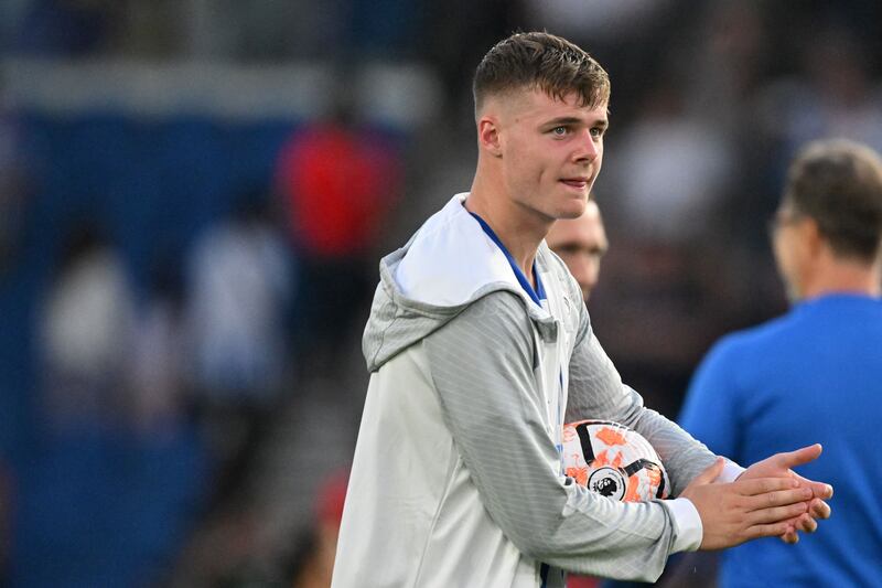 Evan Ferguson with the match ball after scoring a hat trick against Newcastle United. Photograph: Glyn Kirk/AFP via Getty Images.