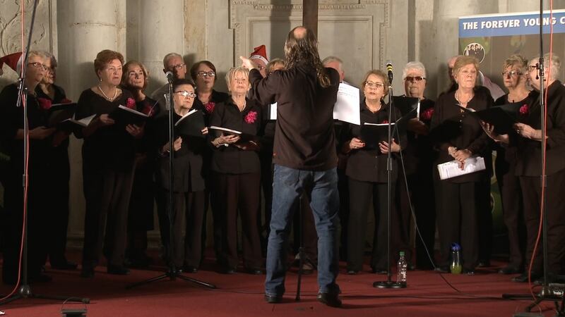 Musical director Brendan Creagh conducts the choir. Photograph: From the Forever Young documentary