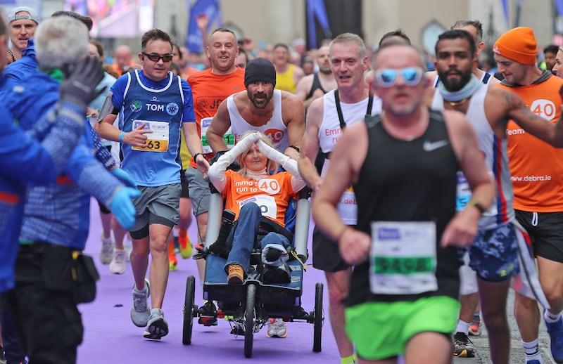 Actor Colin Farrell with his close friend Emma Fogarty, running in the Irish Life Dublin Marathon in Dublin, to raise money for people living with Epidermolysis Bullosa (EB), a rare genetic skin condition suffered by Ms Fofarty.  Photo: Damien Storan/PA Wire