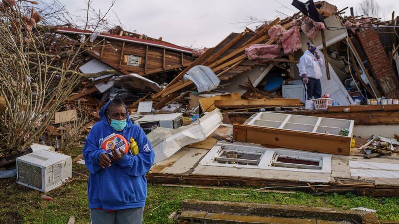 Mable Lovelace salvages some of her belongings in Mayfield, Kentucky, after Friday night’s devastating tornado. Photograph: William DeShazer/New York Times