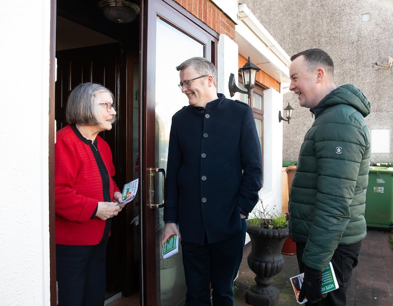 Sinn Féin TD David Cullinane with Michael Doyle (right) talking to Bridget Douglas while out canvassing in Waterford. Photo: Mary Browne