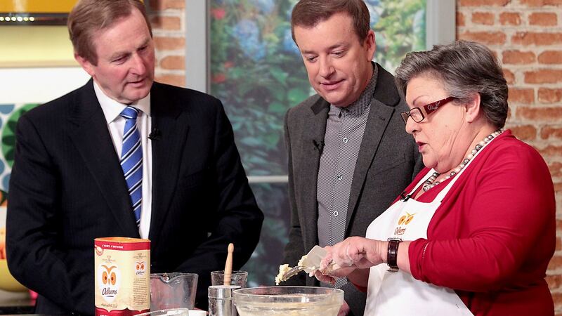 Enda Kenny lends a hand in the kitchen with presenter Alan Hughes and resident cook Catherine Leyden on ‘Ireland AM’ in 2015. Photograph: Brian McEvoy