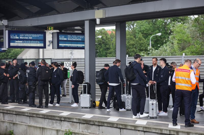 Members of Germany's national football team wait on a platform at the main train station in Erfurt, eastern Germany last month after a training session. Photograph: Ronny Hartmann/AFP via Getty Images