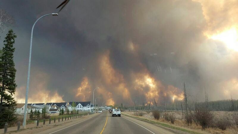 The entire population of the Canadian oil sands city of Fort McMurray has been ordered to evacuate. Photograph: Mary Anne Sexsmith-Segato/The Canadian Press via AP