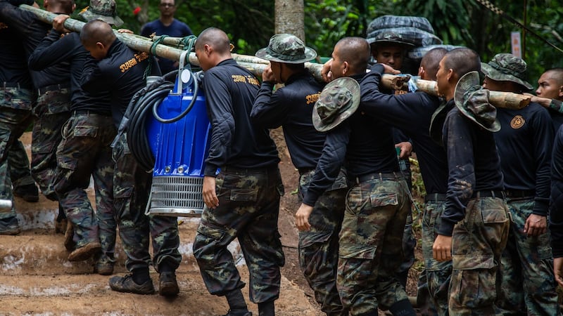 Thai military bring water pumps during the ongoing rescue operation for the child soccer team and their assistant coach at Tham Luang cave in Chiang Rai province, Thailand. Photograph: Lauren DeCicca/Getty Images