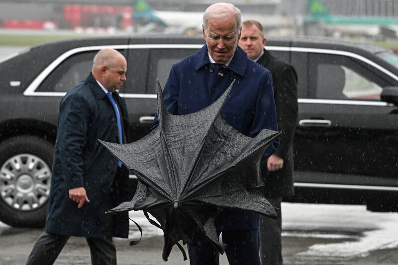 US president Joe Biden opens an umbrella upon arrival at Dublin Airport. Photograph: Jim Watson/AFP