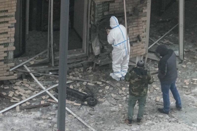 Investigators at the site where Lieutenant General Igor Kirillov was killed by an explosive device planted close to apartments in Moscow. Photograph: AP