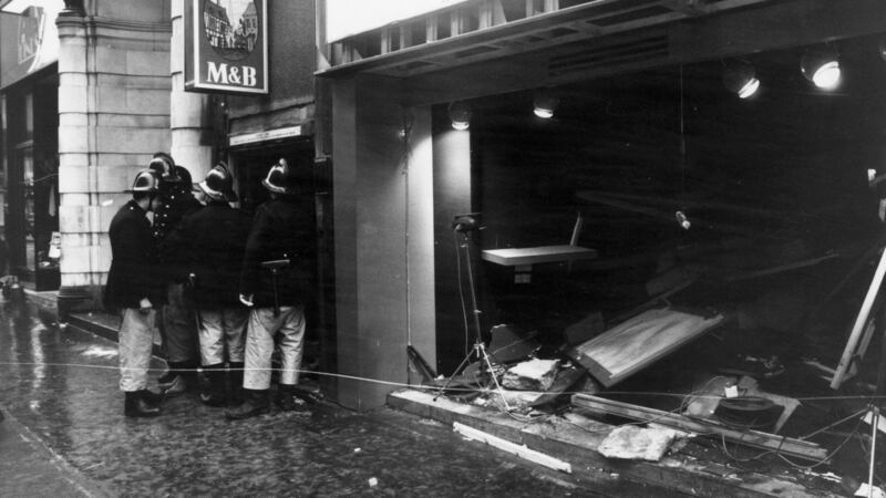 22nd November 1974:  Firemen survey the damage outside the Birmingham pub, 'Tavern in the Town', after an IRA bomb blast.  (Photo by Wesley/Keystone/Getty Images)