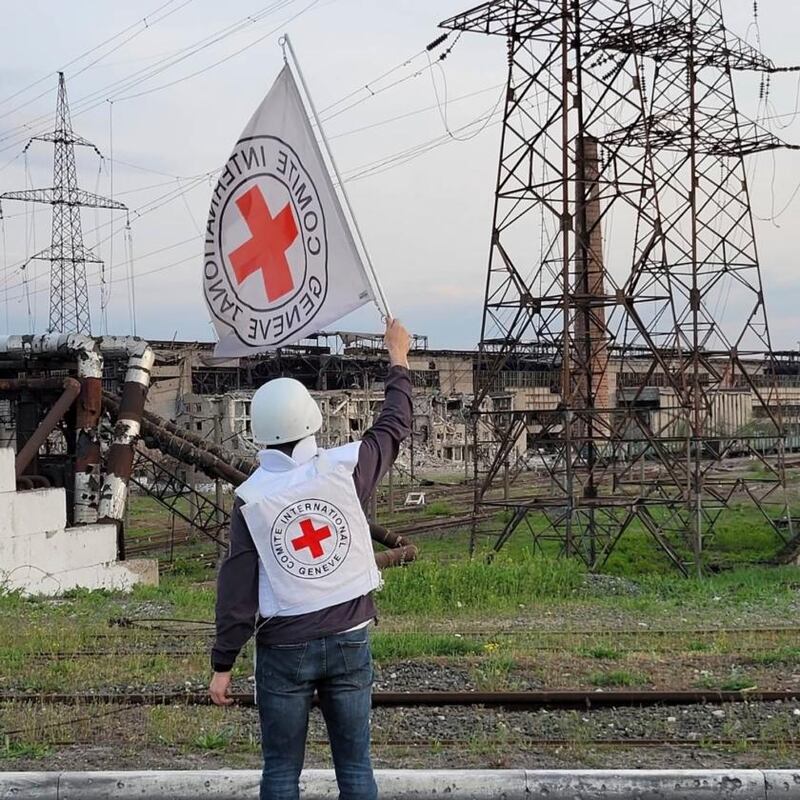 A Red Cross official waves a white flag while approaching the Azovstal steelworks in Mariupol on Sunday. Photograph: International Committee of the Red Cross via AP