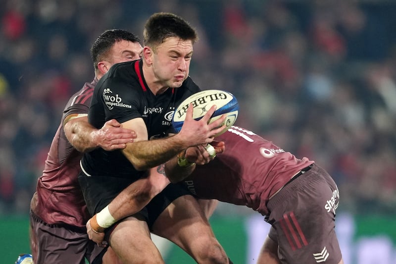 Saracens' Fergus Burke is tackled by Munster's Tom Farrell (left) and Calvin Nash. Photograph: Brian Lawless/PA Wire