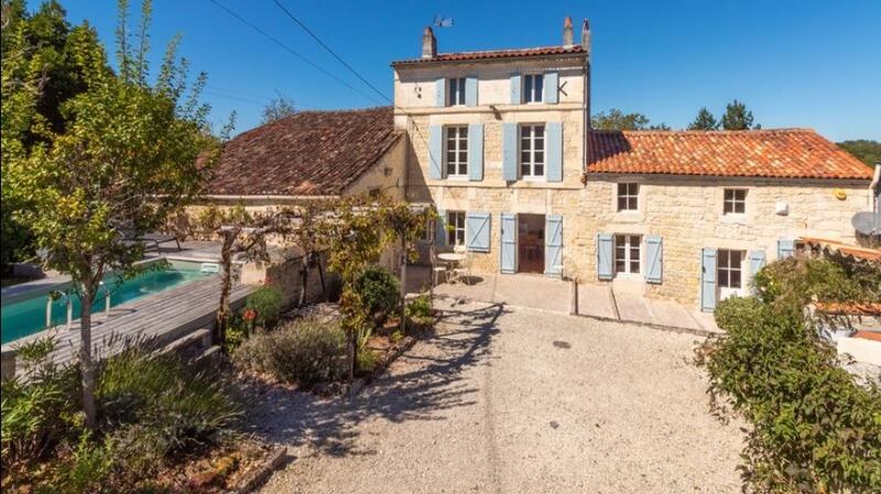 This renovated farmhouse in France comes with a swimming pool, separate unrenovated house, a workshop and garden