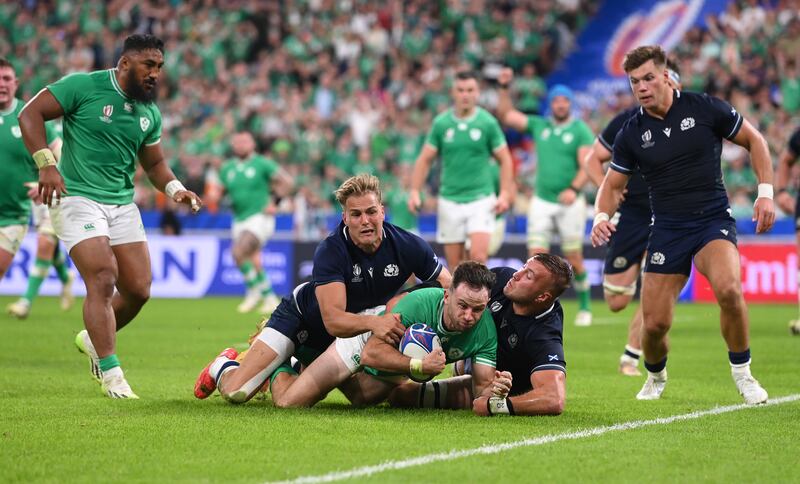 Hugo Keenan secures Ireland's bonus point when scoring his second try just before half-time against Scotland at the Stade de France. Photograph: Stu Forster/Getty Images