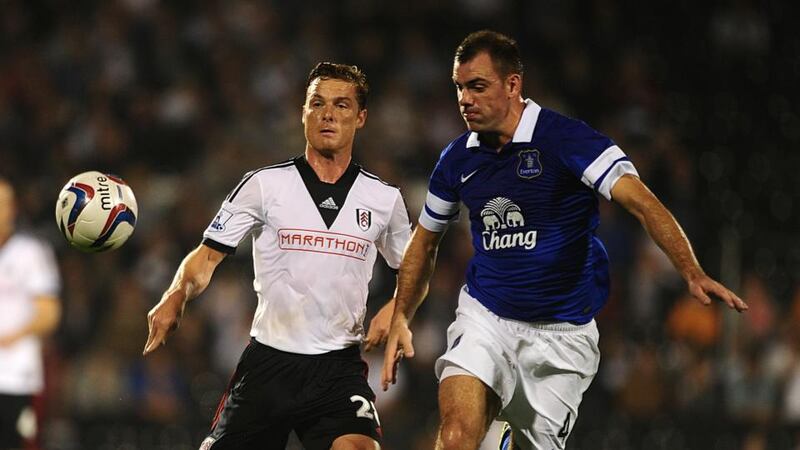 Everton’s Darron Gibson battles for possession with Fulham’s Scott Parker (left) at Craven Cottage. Photograph:  Adam Davy/PA Wire