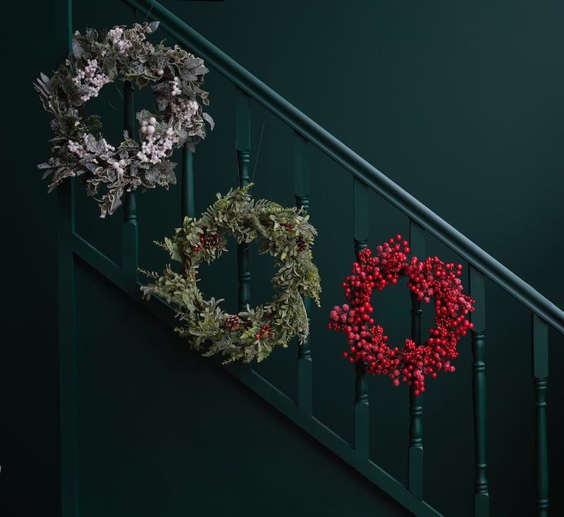 Mixed leaf and white berry wreaths, €95 each, and wreath with red berries, €55 at Brown Thomas