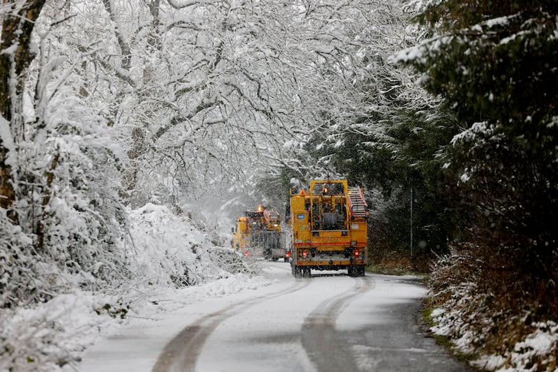 05/01/2025 - NEWS - Esb repair crews tend to a fallen line  in the hills near Castlewarren near Kilkenny City during heavy snow fall and weather warnings. Photograph: Alan Betson / The Irish Times

