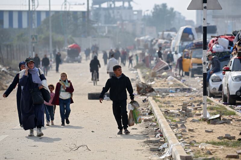 Palestinians walk along Salah al-Din road in Nuseirat as they make their way to the northern part of the Gaza Strip on Tuesday. Photograph: Eyad Baba/AFP via Getty Images