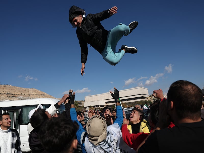 Syrians celebrate the toppling of president Bashar al-Assad in Damascus's central Umayyad Square on December 13th, 2024. Photograph: Omar Haj Kadour/AFP/Getty