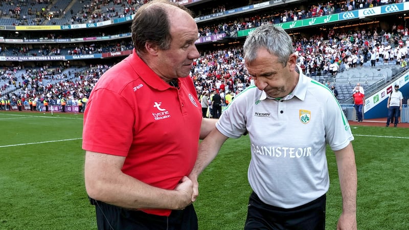 Tyrone’s joint manager Feargal Logan shakes hands with Kerry manager Peter Keane after the game. Photograph: Laszlo Geczo/Inpho