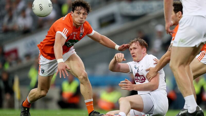 Armagh’s James Morgan and Kildare’s Paul Cribbin. Photograph: Oisin Keniry/Inpho