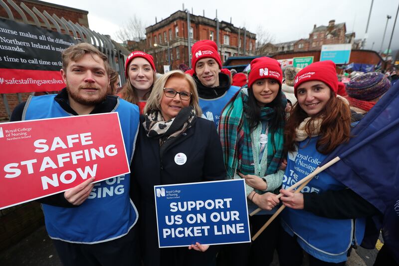 Royal College of Nursing Northern Ireland director Pat Cullen (centre) joins the picket line outside the Royal Victoria Hospital in Belfast as nurses across the North take part in a 12-hour strike over pay. Photograph: Liam McBurney/PA