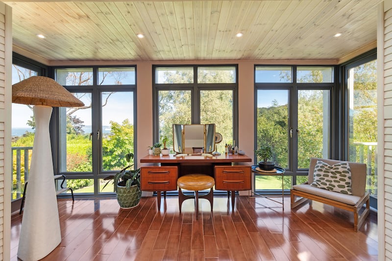 The seating area in main bedroom can be closed off with shutters