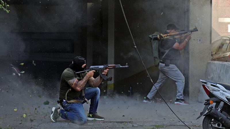 Shia fighters from Hizbullah and the Amal Movement during clashes in the Tayouneh suburb of Beirut on Thursday. Photograph: Ibrahim Amro/AFP via Getty Images